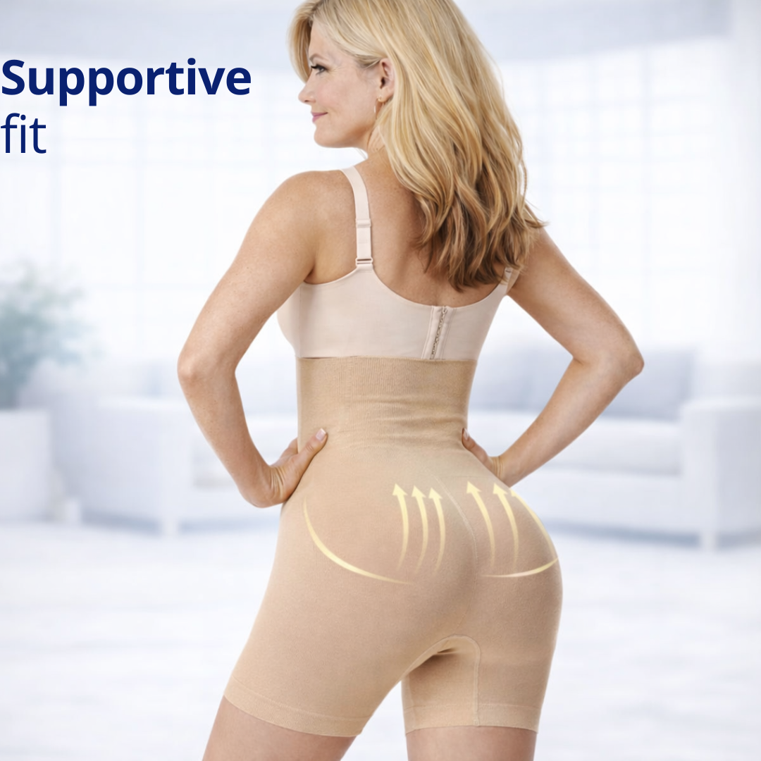 Woman wearing a beige compression pants showing how the compression works on the body.